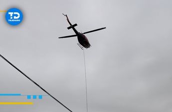Elementos de Protección Civil realizan labores desde un helicóptero. | Marcela Cuevas