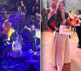 Carlos Rivera canta con fanática en concierto.